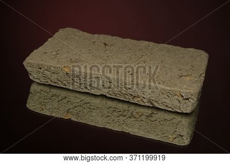 Sweet Halva Isolated On Red Background On Burlap Napkin