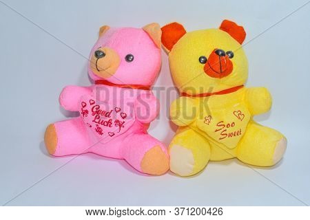 Pink & Yellow Two Teddy Bear On White Background With A Titile.