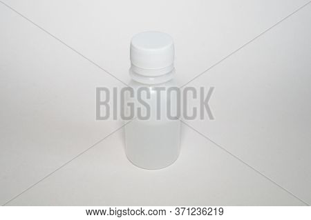 White Plastic Bottle Container For Vaccine On A White Background