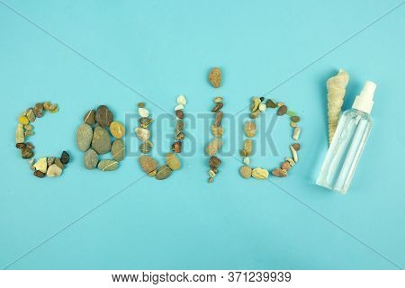 Inscription Corona Virus From Sea Pebbles, A Symbol Of Summer 2020, The Concept Of A Summer Holiday 