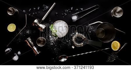 Refreshing Mint Julep Whiskey Cocktail In Misted Frozen Metal Glass And Bar Accessories Shaker Jigge