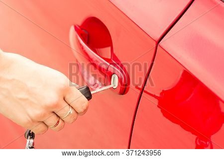 Close-up, The Girl Opens The Door Of A Red Car