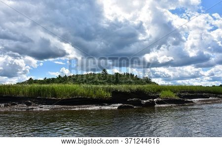 Dark Gray Clouds Over Tidewater Mud Flats.