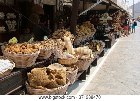 Symi, Greece - June 14, 2020: Sponge Shops In Symi Town, Symi Island, Greece