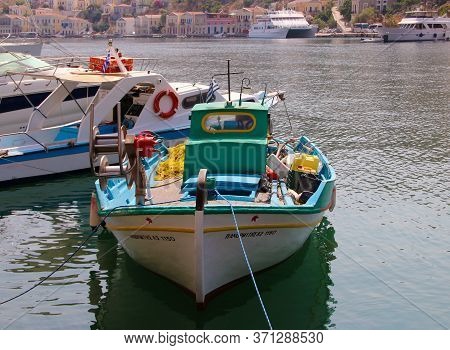 Symi, Greece - June 14, 2020: Fishing Boats In The Port Of Symi Town, Symi Island, Greece