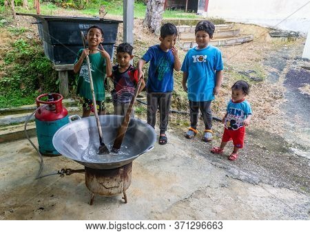 Cooking Traditional Malaysian Sweet Desert, Dodol By The Villagers During Hari Raya.