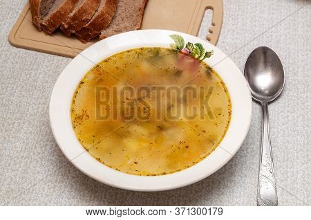 Plate With Soup. Traditional Russian Rassolnik Soup With Pickles. Rassolnik And Bread.