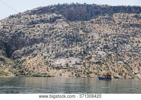 A Beautiful Lake Surrounded By Huge Mountains
