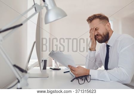 A Lot Of Work In The Office. Tired Busy Businessman Is Working With Computer.