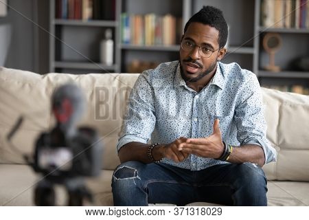 African Guy Filming Online Training Webinar Using Camcorder