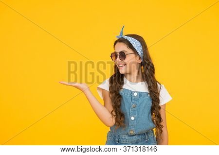 Retro Girl Presenting Product. Small Kid Wear Summer Outfit. Cheerful Child Has Vintage Look. Headke