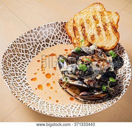 Plate of mussels with creme dubarry in restaurant