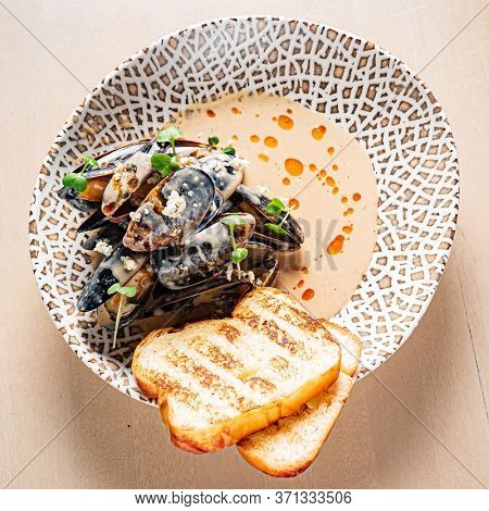 Plate of mussels with creme dubarry in restaurant