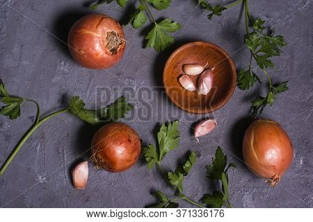 Some Onions, Garlic And Parsley. Food Ingredients