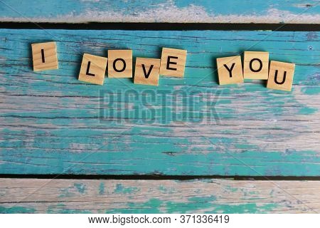Top View I Love You Word Written On Wood Block. Love Wood Word With Copy Space.