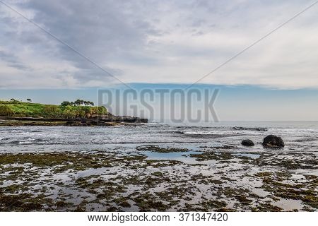 Coastline Near The Tanah Lot Temple, The Most Important Indu Temple Of Bali, Indonesia Befor Sunset