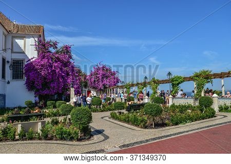 Lisbon, Portugal - July 2, 2019:  People Relax On Miradouro Santa Luzia In Alfama District, Lisbon, 
