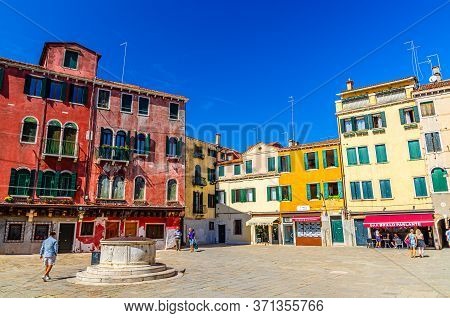 Venice, Italy, September 13, 2019: Campo San Sin Square With Stone Well And Old Colorful Buildings I