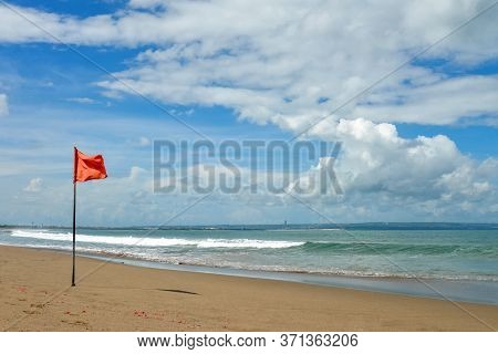 Petitenget Beach In Seminyak  With Red Flag