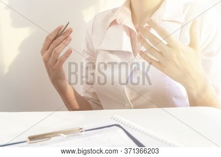 Doctor Who Explains To Patient. Explaining Hand Jestures Of A Female Doctor