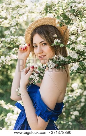 Sensual Calm Portrait Of Beautiful Hipster Woman In Blooming Bush With White Flowers Of Spirea. Copy