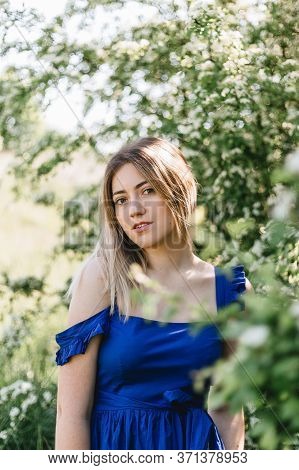 Sensual Calm Portrait Of Beautiful Hipster Woman In Blooming Bush With White Flowers Of Spirea. Copy