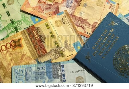 Dubai / Uae - June 10, 2020: Background Made Of Kazakhstan National Currency With Passport, Top View
