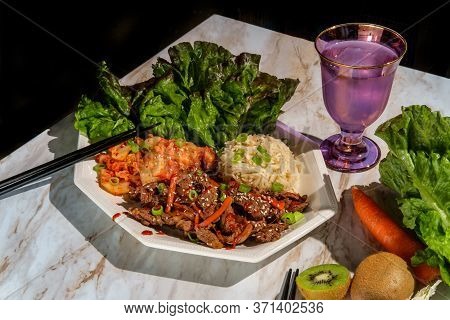 Korean Beef Bulgogi Ssambap Lettuce Wraps With Spicy Kimchi And Gochujang Hot Sauce