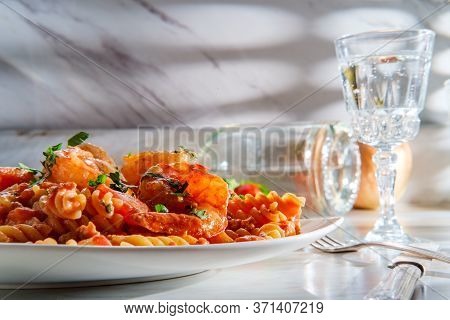 Gluten-free Fusilli Pasta In Creamy Vodka Tomato Sauce With Sausage Shrimp And Green Peas