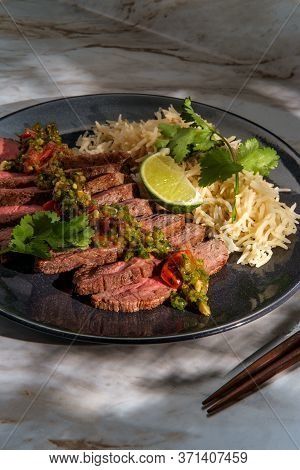 Rib-eye Steak Cooked Rare With Hot And Spicy Thai Crying Tiger Sauce Also Called Suea Rong Hai