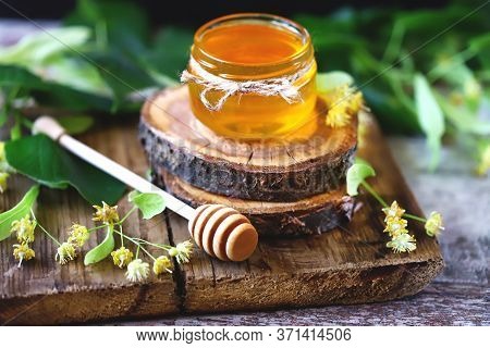 Selective Focus. Linden Honey In A Jar. Leaves And Flowers Of Linden. Freshly Linden Honey.