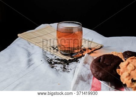 Glass Of Hot Tea Drink With Almond Milk Cookie And Chocolate Chip Nut Cookie On White Table Black Ba