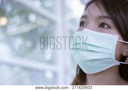 Coronavirus, Woman With Medical Face Mask,women Wearing Masks To Protect From The Corona Virus.
Conc