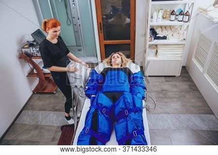 Pressotherapy Machine On Woman In Beauty Center