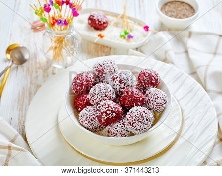 No-bake Berry Bliss Balls With Desiccated Coconut And Chia Seeds Mixed With Peanut Butter And Raspbe