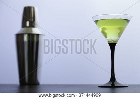 Cocktail Glass And Cocktail Shaker On White