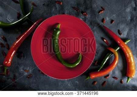 Fresh Spicy Green Pepper On Red Ceramic Plate