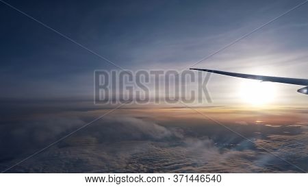 Beautiful Sun On Fantastic Boundless Horizon Over Thick White Clouds Against Vast Blue Sky Under Fly