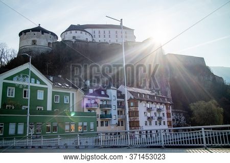 Beautiful view Kufstein Fortress on a hillside and traditional color houses on a forefront in autumn sunny day, Kufstein Austria.