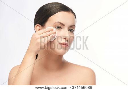 Young Girl Remove Cosmetic From Face. Skin Care With Cotton Pad.