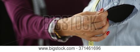 Tailor Measures Armhole Length On Mannequin Clothes. Experienced Seamstress Hand Hold Sleeve, Make M