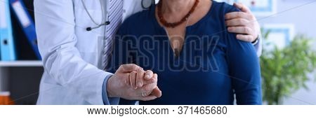Male Doctor Hugged Elderly Lady Helping To Go Out. Social Isolation Elderly. Multiplicity Disorders 