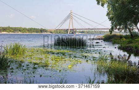 Modern Road Cable-stayed Bridge Over River With One Pylon And Steel Cables Of Semi-fan Design. Pivni