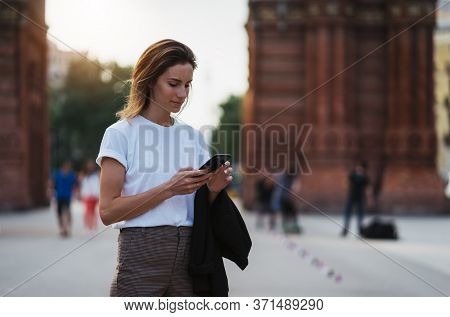 Portrait Traveler Woman In White T-shirt Writes Message On Smart Phone Walking Arc De Triomphe Of Ba