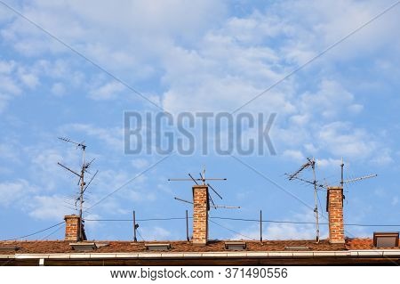 Television Antennas,  Vhf And Uhf Frequencies, At The Top Of A European Roof. Vhf And Uhf Are Two Of