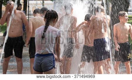 Gomel, Belarus - June 10, 2020: Children Bathe In A Fountain In The Park Gromyko
