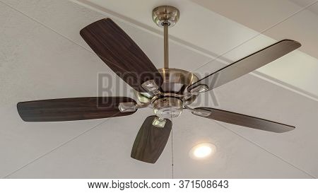 Panorama Frame Electrical Fan With Built In Lights Installed On Decorative Wooden Ceiling Beam