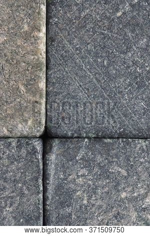 Stone Dark Textured Background Close-up. Natural Gray Backdrop Or Wallpaper. Rough Shabby Surface. S