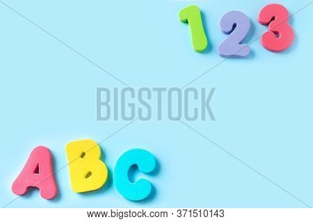 Colorful Letters A, B, C And Numbers 1, 2, 3 On Blue Background. Concept Of Education, Back To Schoo