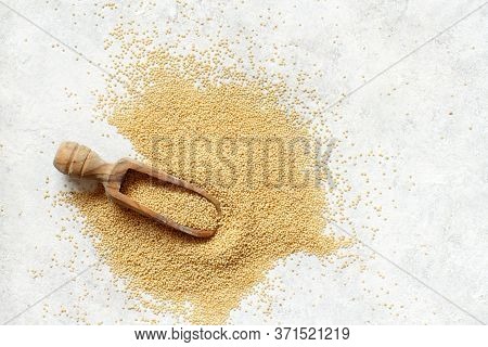 Scoop Of Raw Amaranth Grain Top View On A White Table